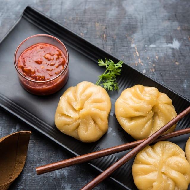 Chicken Dumpling in Hot Sesame Sauce (8 Pieces).